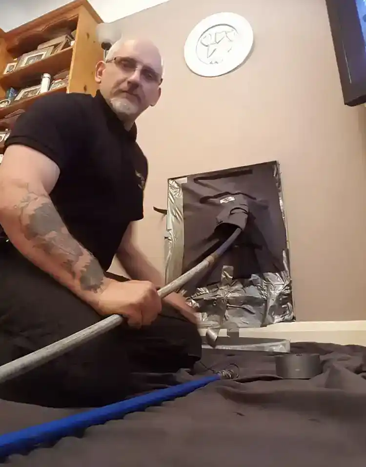 Tony Preston cleaning a chimney and most importanty with no mess whatsover